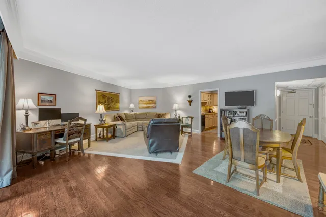 a view of a livingroom with furniture and a flat screen tv