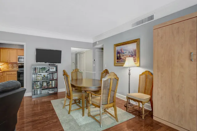 a living room with furniture and a lamp