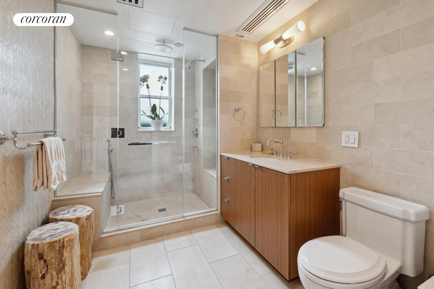 150 West 87th Street, Unit PHS Manhattan, NY 10024 - Photo 11 of 16 a bathroom with a sink a toilet and shower