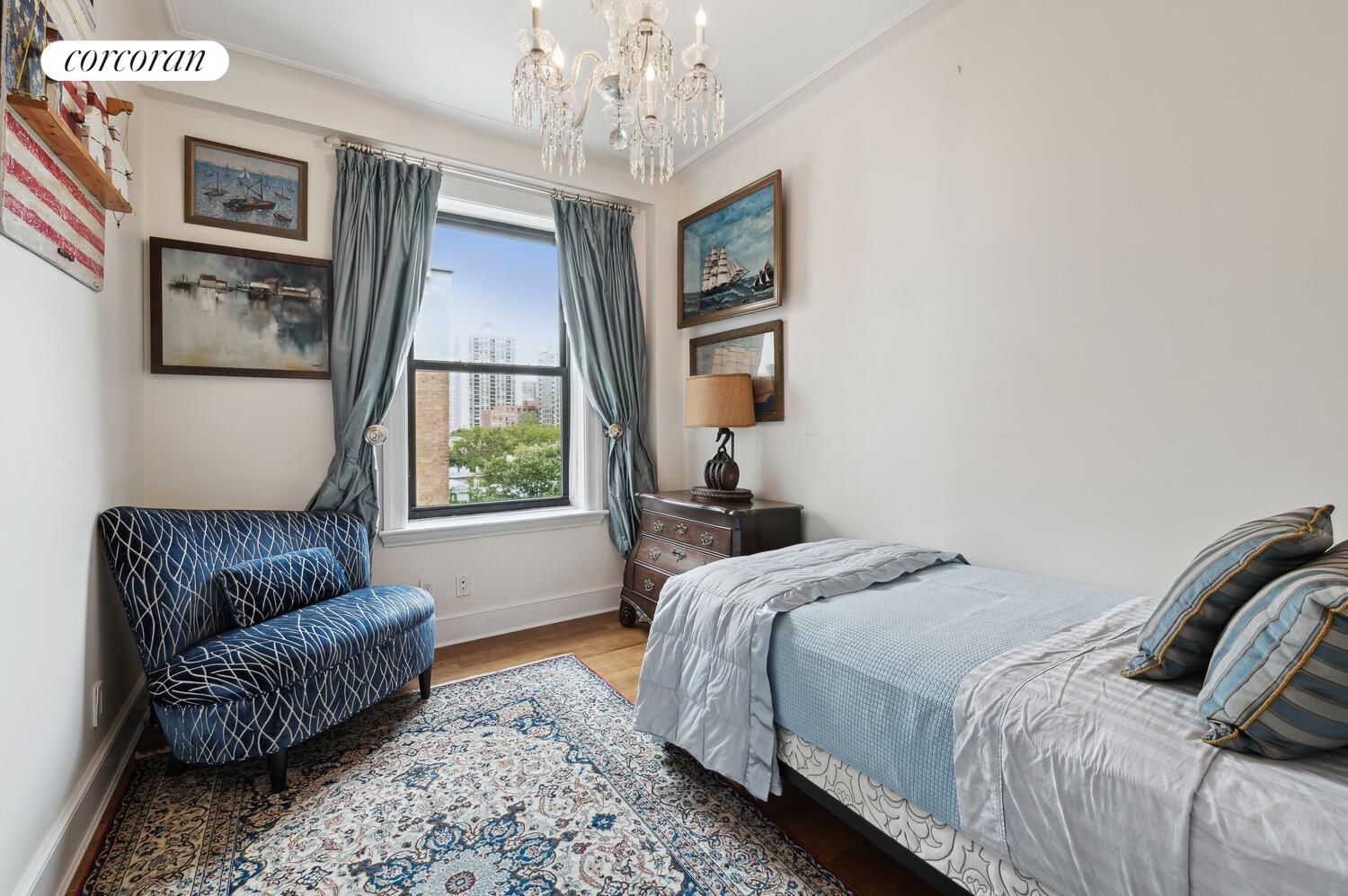 150 West 87th Street, Unit PHS Manhattan, NY 10024 - Photo 14 of 16 a bedroom with a bed couch and window