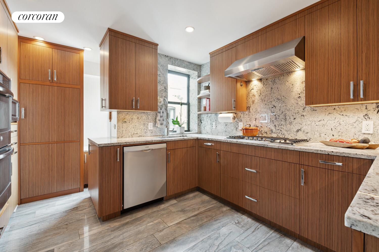 150 West 87th Street, Unit PHS Manhattan, NY 10024 - Photo 5 of 16 a kitchen with granite countertop wooden cabinets and white appliances