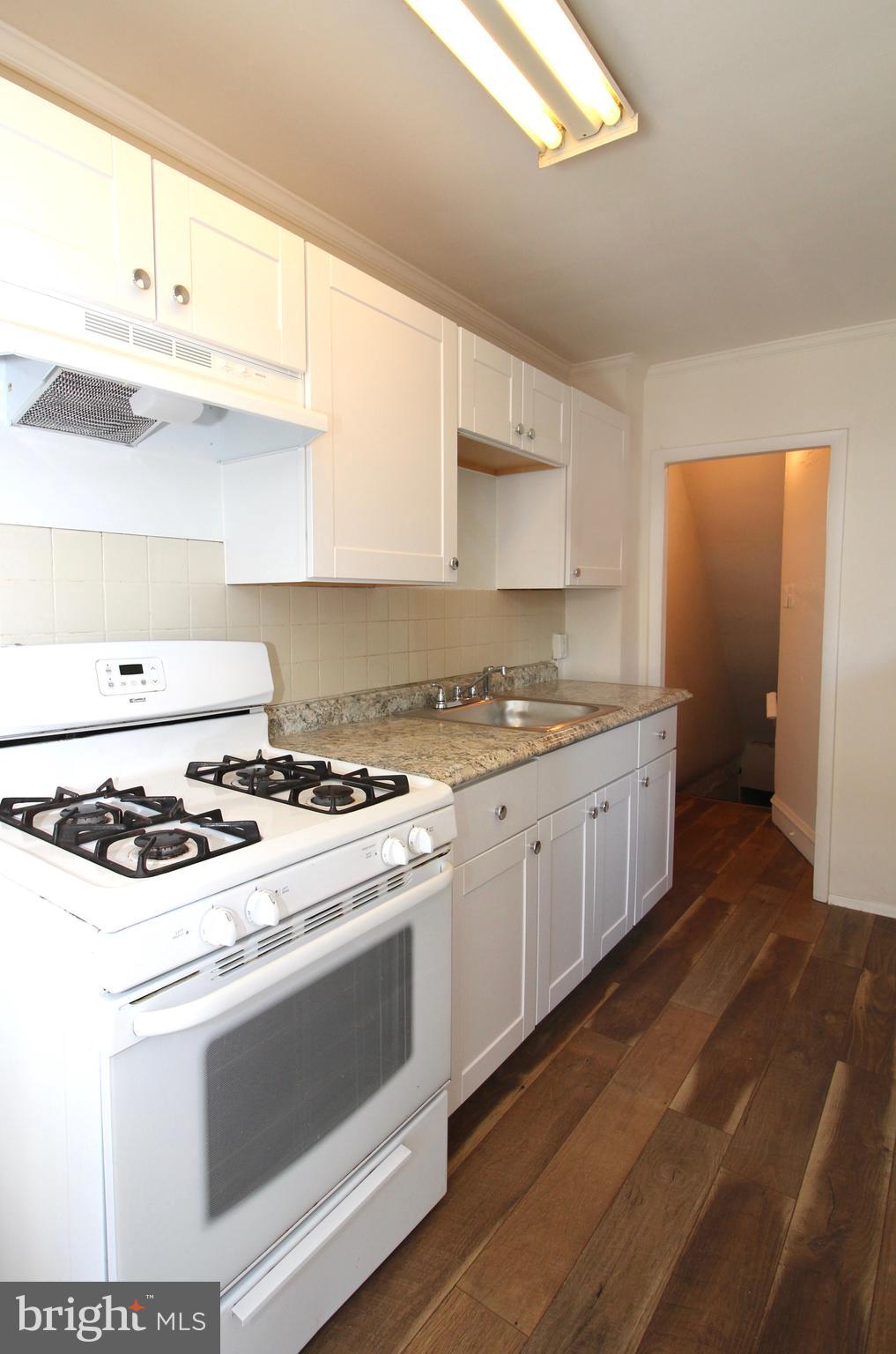 280 Sheffield Road Lansdowne, PA 19050 - Photo 7 of 14 New white cabinets, counter, flooring