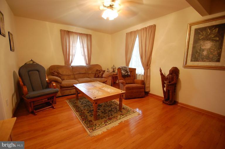 1900 Perryman Road Aberdeen, MD 21001 - Photo 11 of 21 a living room with furniture a lamp and a window
