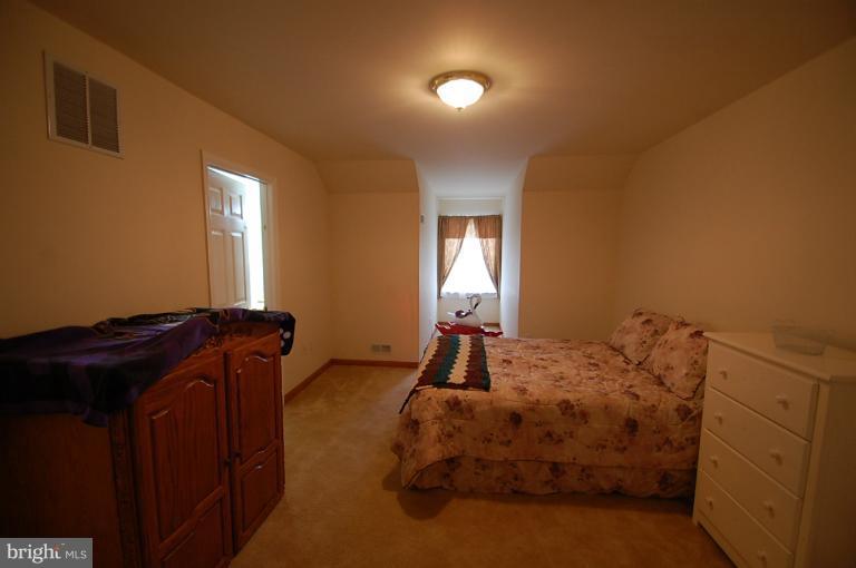 1900 Perryman Road Aberdeen, MD 21001 - Photo 12 of 21 a bedroom with a bed and a mirror