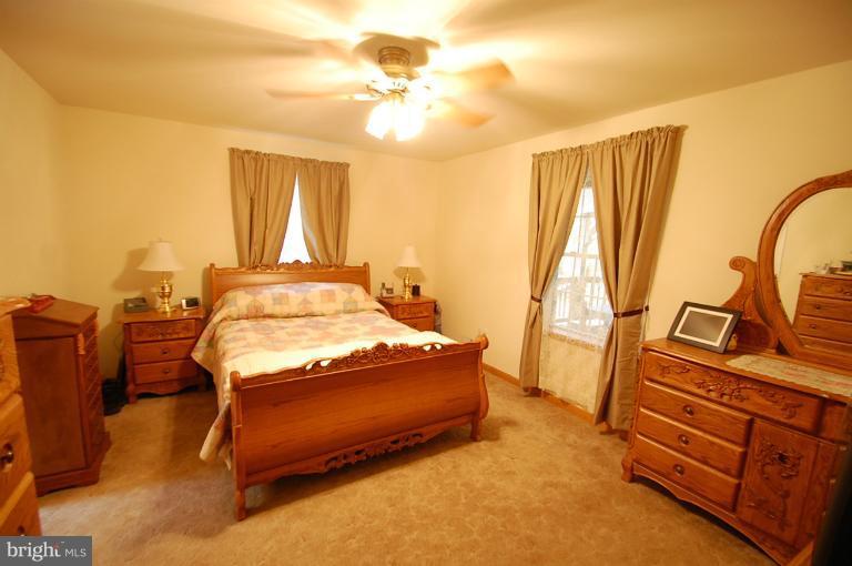1900 Perryman Road Aberdeen, MD 21001 - Photo 14 of 21 a bedroom with a bed and wooden floor