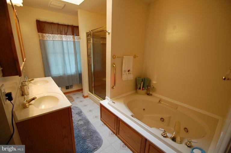 1900 Perryman Road Aberdeen, MD 21001 - Photo 15 of 21 a bathroom with a tub sink and shower