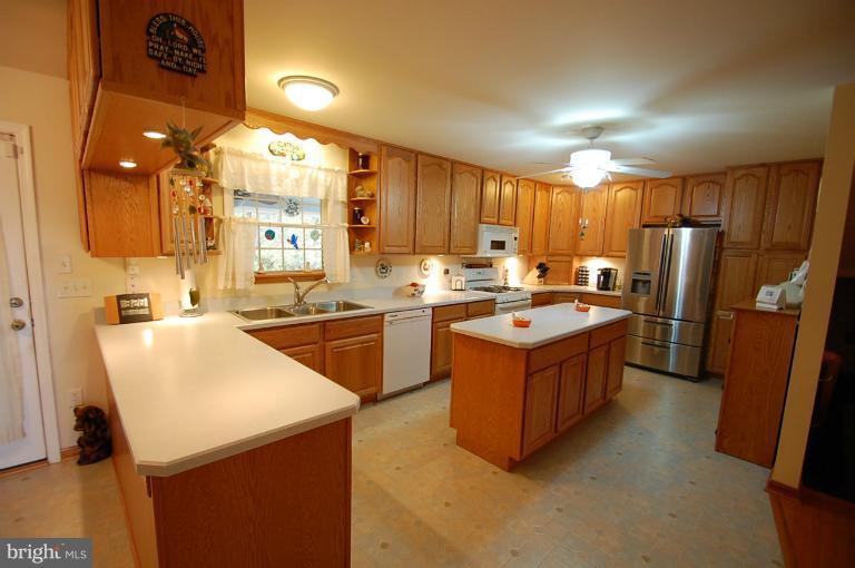 1900 Perryman Road Aberdeen, MD 21001 - Photo 5 of 21 a kitchen with a refrigerator a sink dishwasher and a refrigerator