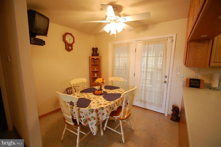1900 Perryman Road Aberdeen, MD 21001 - Photo 6 of 21 a view of a dining room with furniture and a window