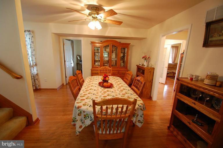 1900 Perryman Road Aberdeen, MD 21001 - Photo 7 of 21 a view of a dining room with furniture window and wooden floor