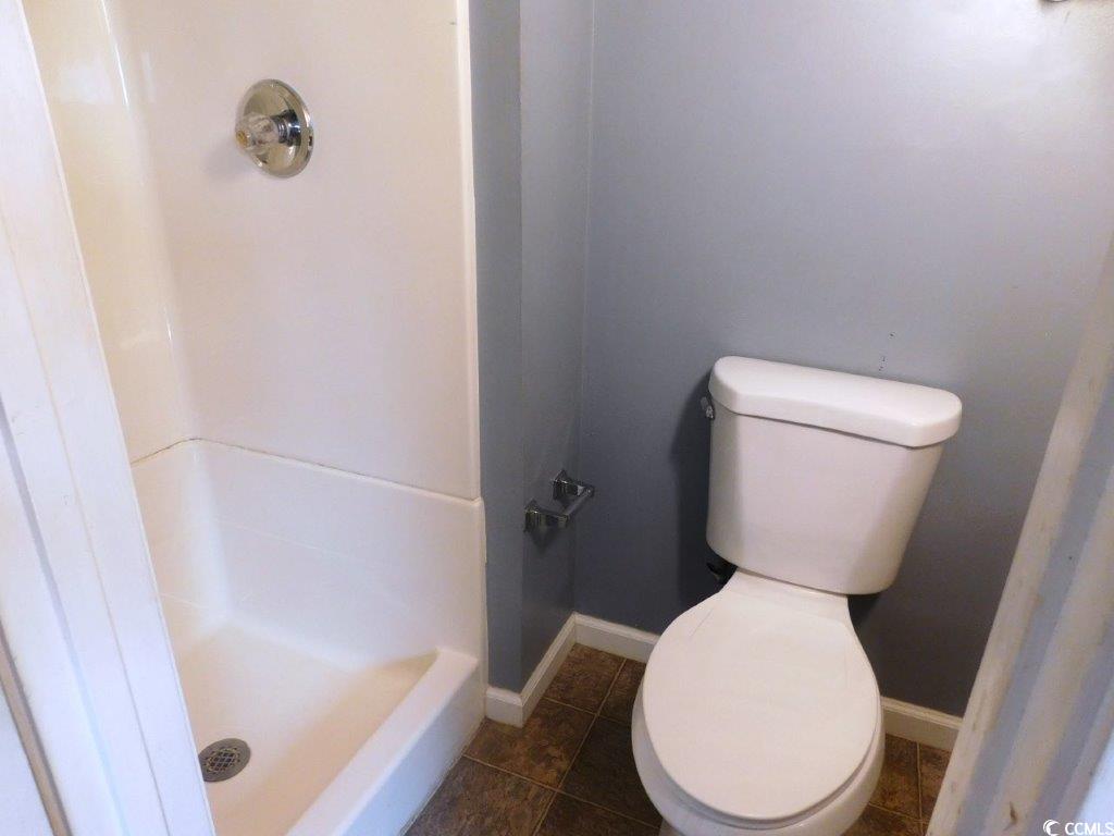 1202 Tiffany Lane, Unit D Myrtle Beach, SC 29577 - Photo 15 of 21 Full bathroom with a shower stall and tile patterned floors