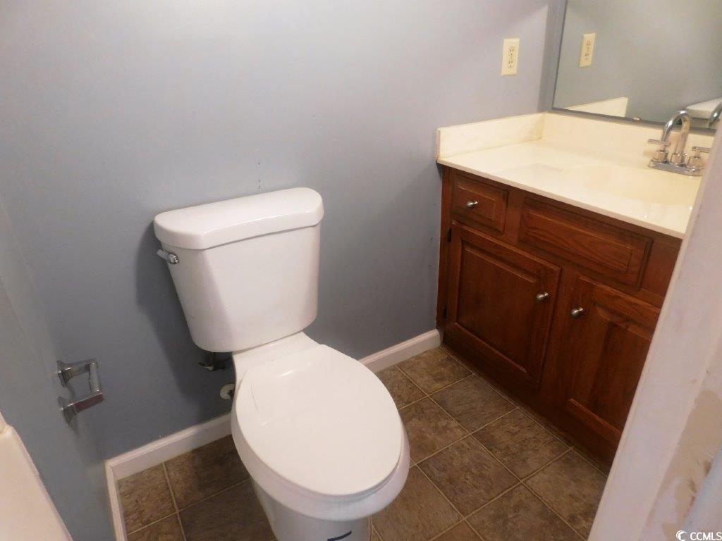 1202 Tiffany Lane, Unit D Myrtle Beach, SC 29577 - Photo 16 of 21 Half bathroom with toilet and vanity