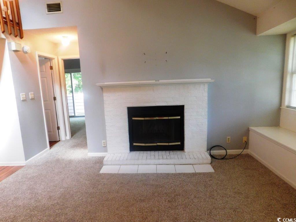 1202 Tiffany Lane, Unit D Myrtle Beach, SC 29577 - Photo 5 of 21 Detailed view of carpet floors and a fireplace
