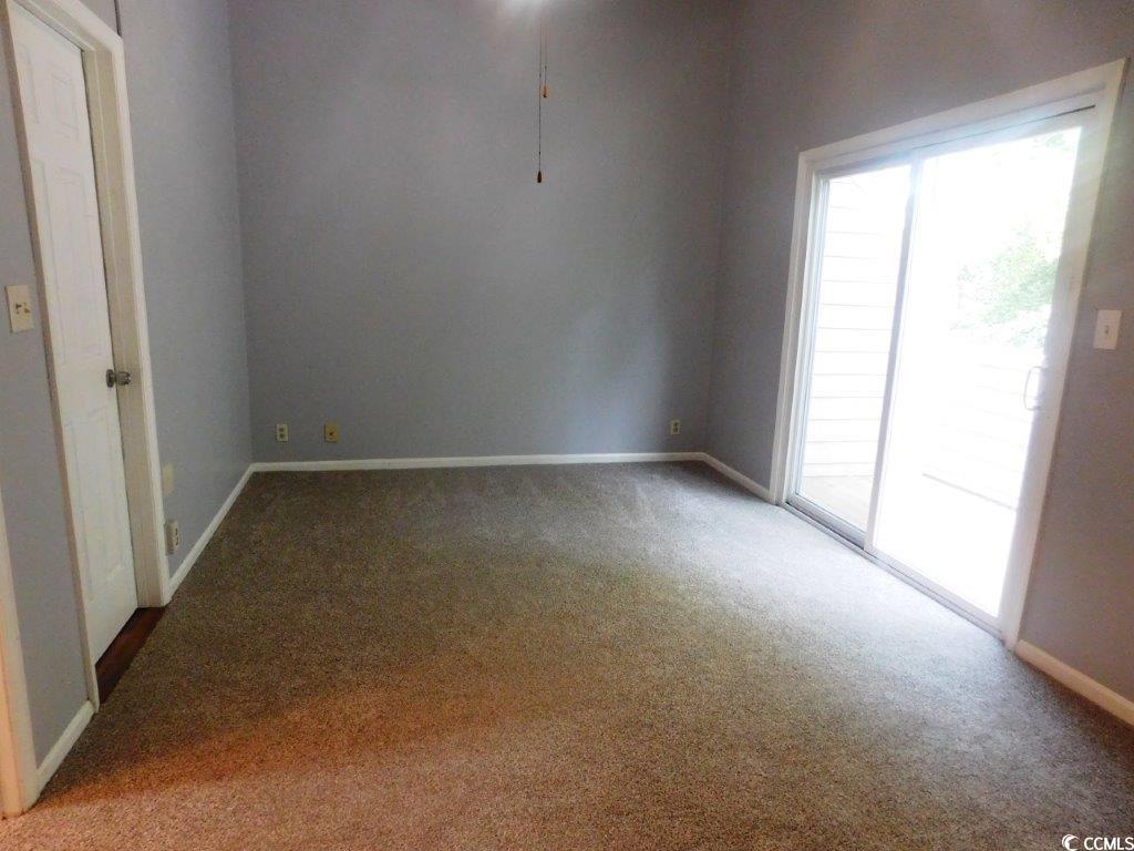 1202 Tiffany Lane, Unit D Myrtle Beach, SC 29577 - Photo 7 of 21 Spare room featuring carpet and plenty of natural light