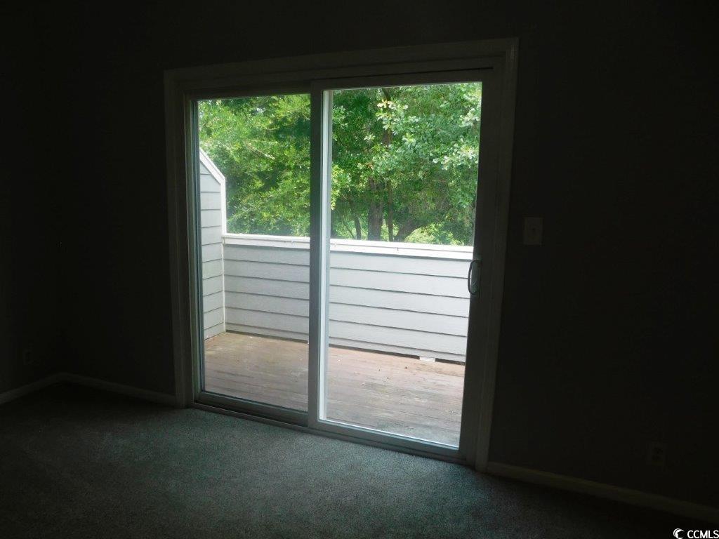 1202 Tiffany Lane, Unit D Myrtle Beach, SC 29577 - Photo 8 of 21 Carpeted spare room with healthy amount of natural light