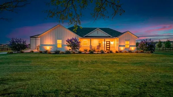 a view of a house with a big yard