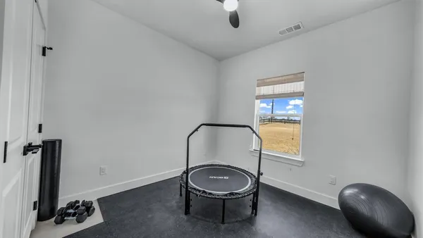 a bathroom with a toilet a sink and a mirror