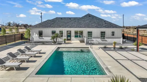 a view of a patio with couches chairs and a fire pit