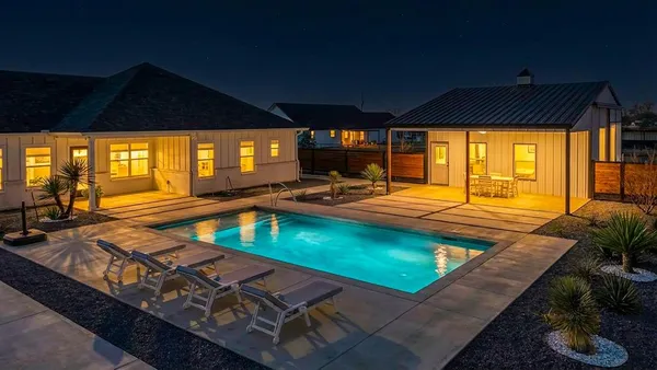 a view of a swimming pool with a lounge chairs