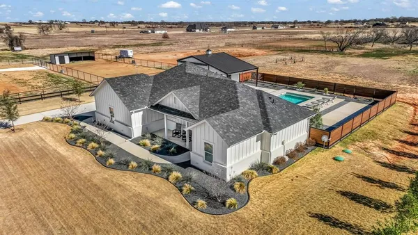 an aerial view of a house with a ocean view