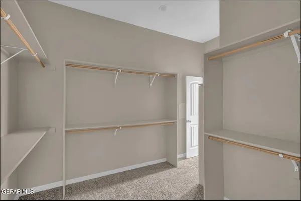 a view of an empty walk in closet