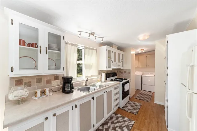a view of a house with pool and sitting area