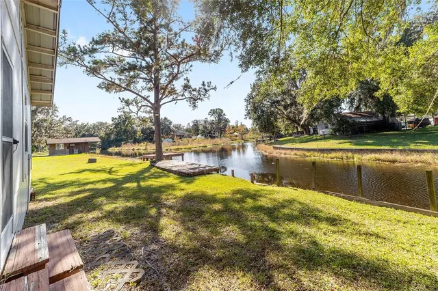 a view of a swimming pool with an outdoor space and seating area