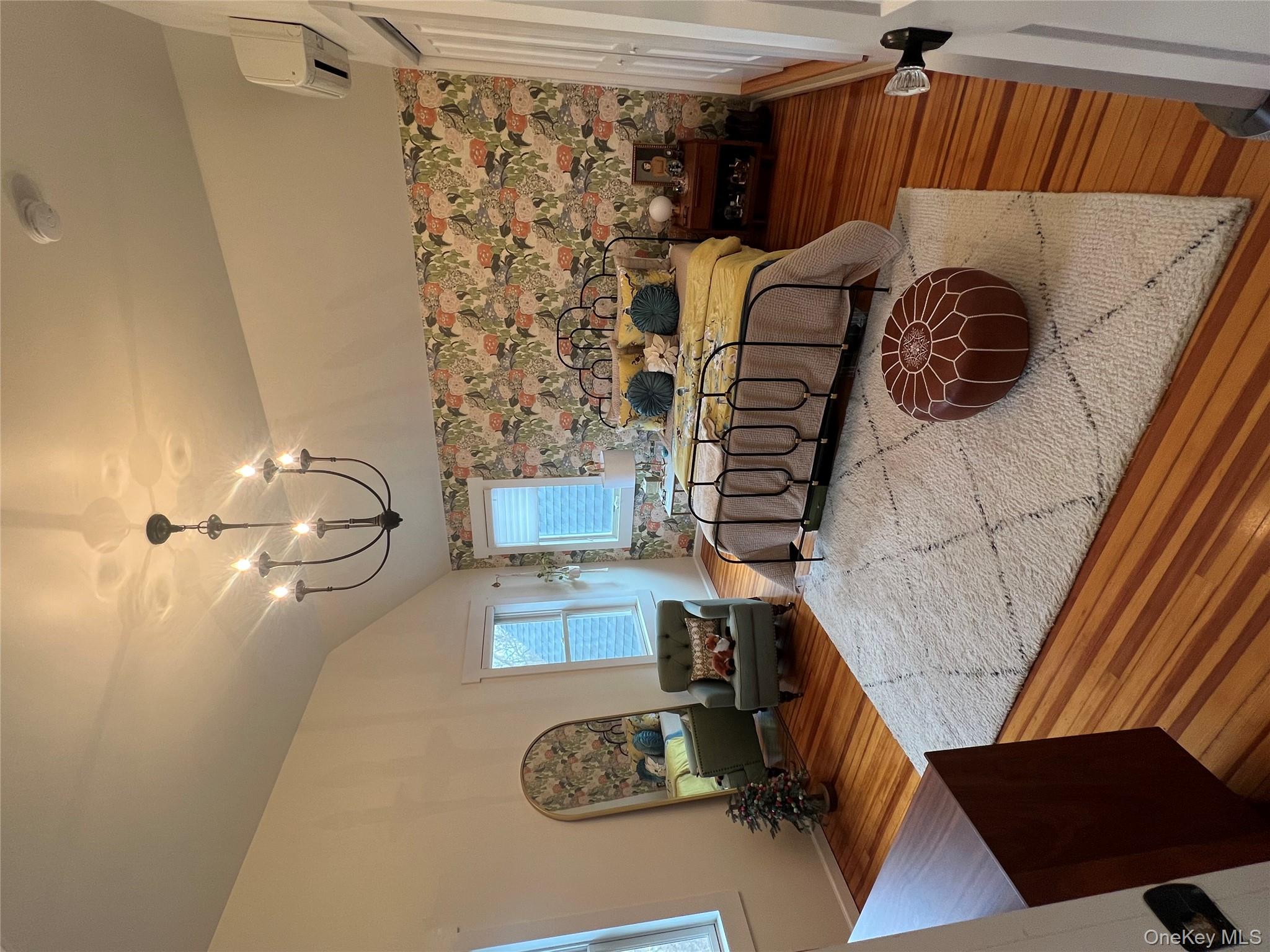 103 Filors Lane, Unit 101 Stony Point, NY 10980 - Photo 16 of 23 a living room with couches chairs and kitchen view