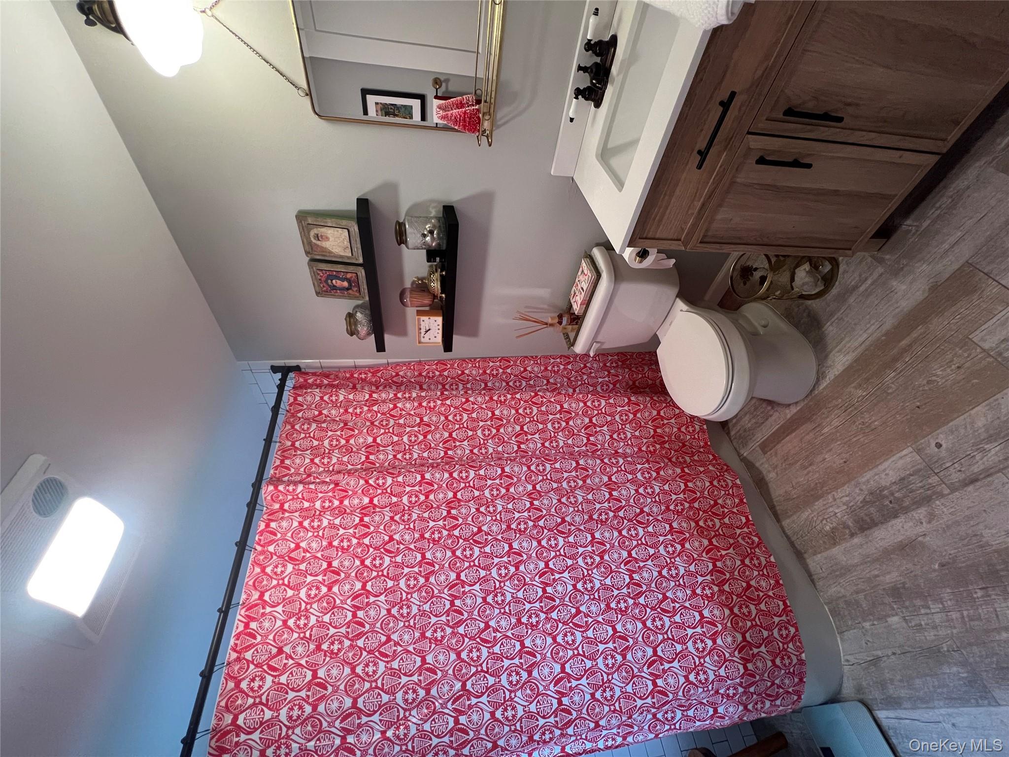 103 Filors Lane, Unit 101 Stony Point, NY 10980 - Photo 19 of 23 a bathroom with a toilet sink and mirror