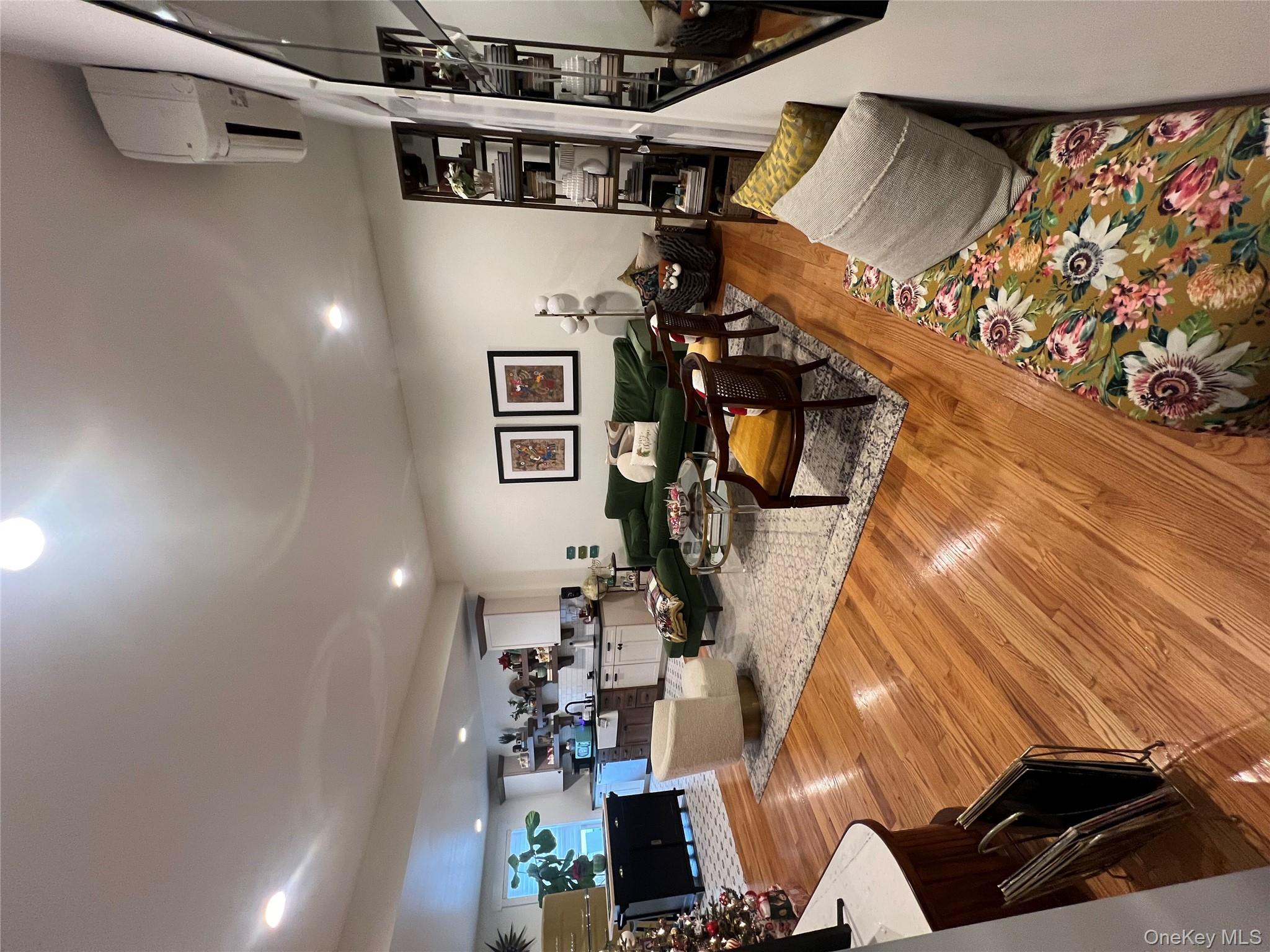 103 Filors Lane, Unit 101 Stony Point, NY 10980 - Photo 2 of 23 a living room with furniture and a flat screen tv