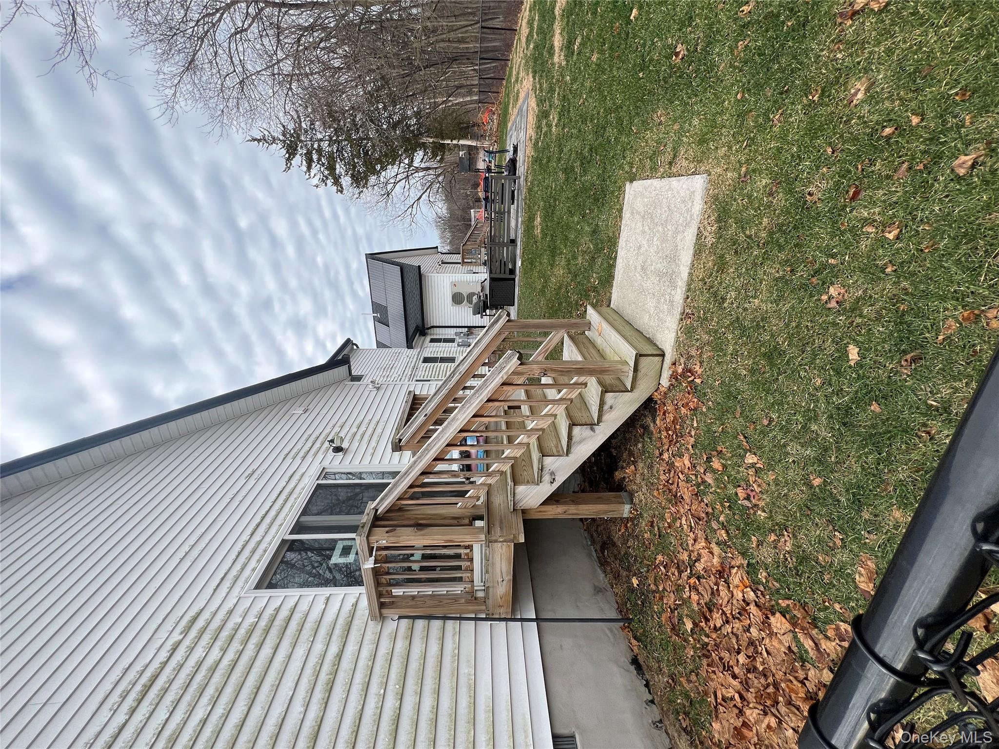 103 Filors Lane, Unit 101 Stony Point, NY 10980 - Photo 23 of 23 a view of a house with backyard and trees