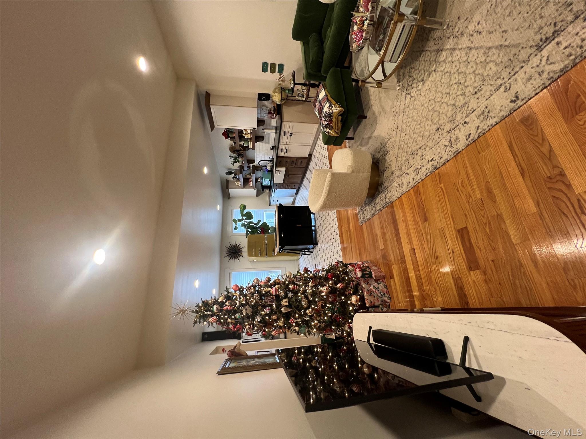 103 Filors Lane, Unit 101 Stony Point, NY 10980 - Photo 3 of 23 a living room with furniture and a wooden floor