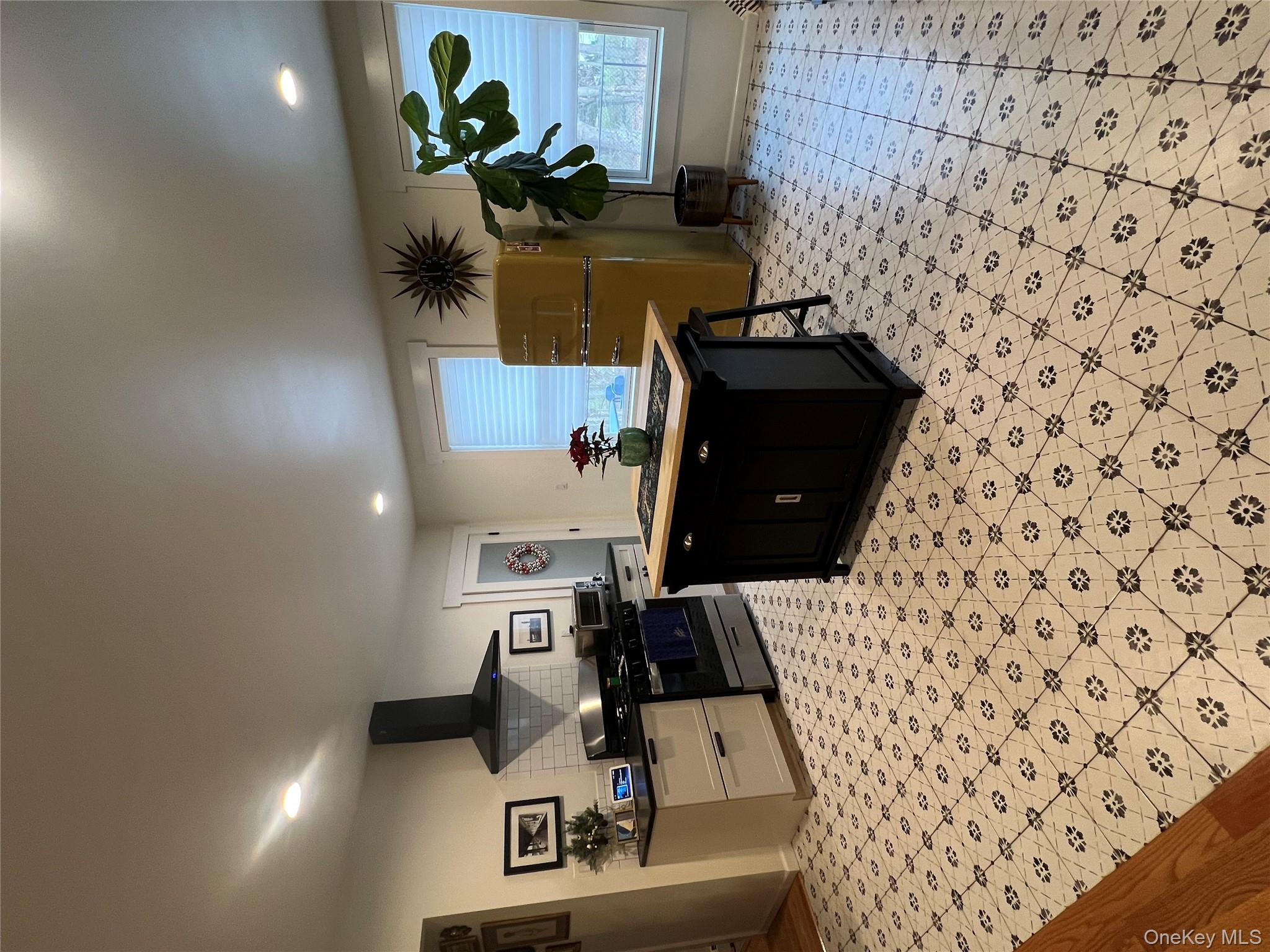 103 Filors Lane, Unit 101 Stony Point, NY 10980 - Photo 8 of 23 a kitchen with stainless steel appliances granite countertop a sink and a refrigerator