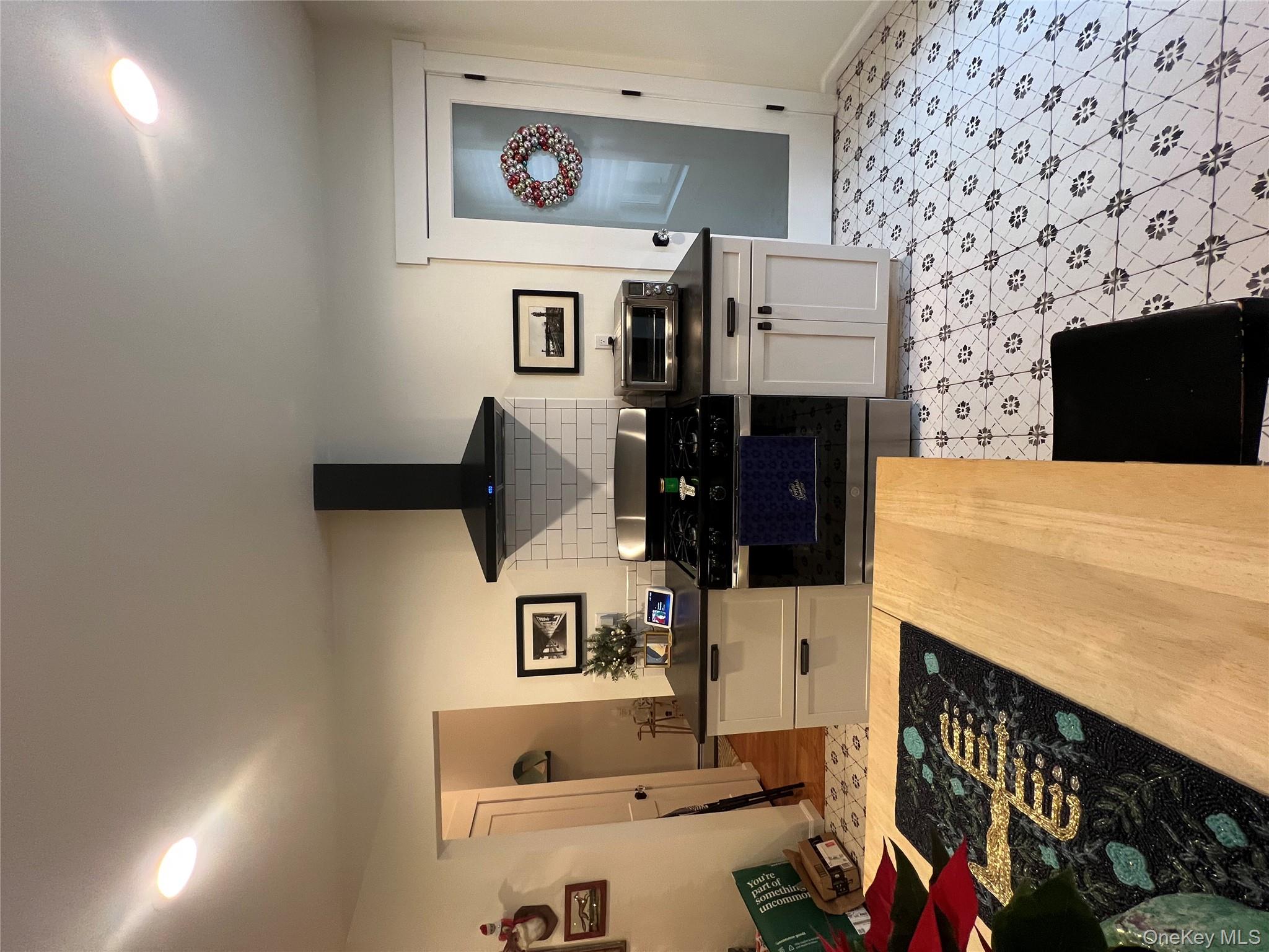103 Filors Lane, Unit 101 Stony Point, NY 10980 - Photo 10 of 23 a kitchen with stainless steel appliances granite countertop a stove a sink and a refrigerator