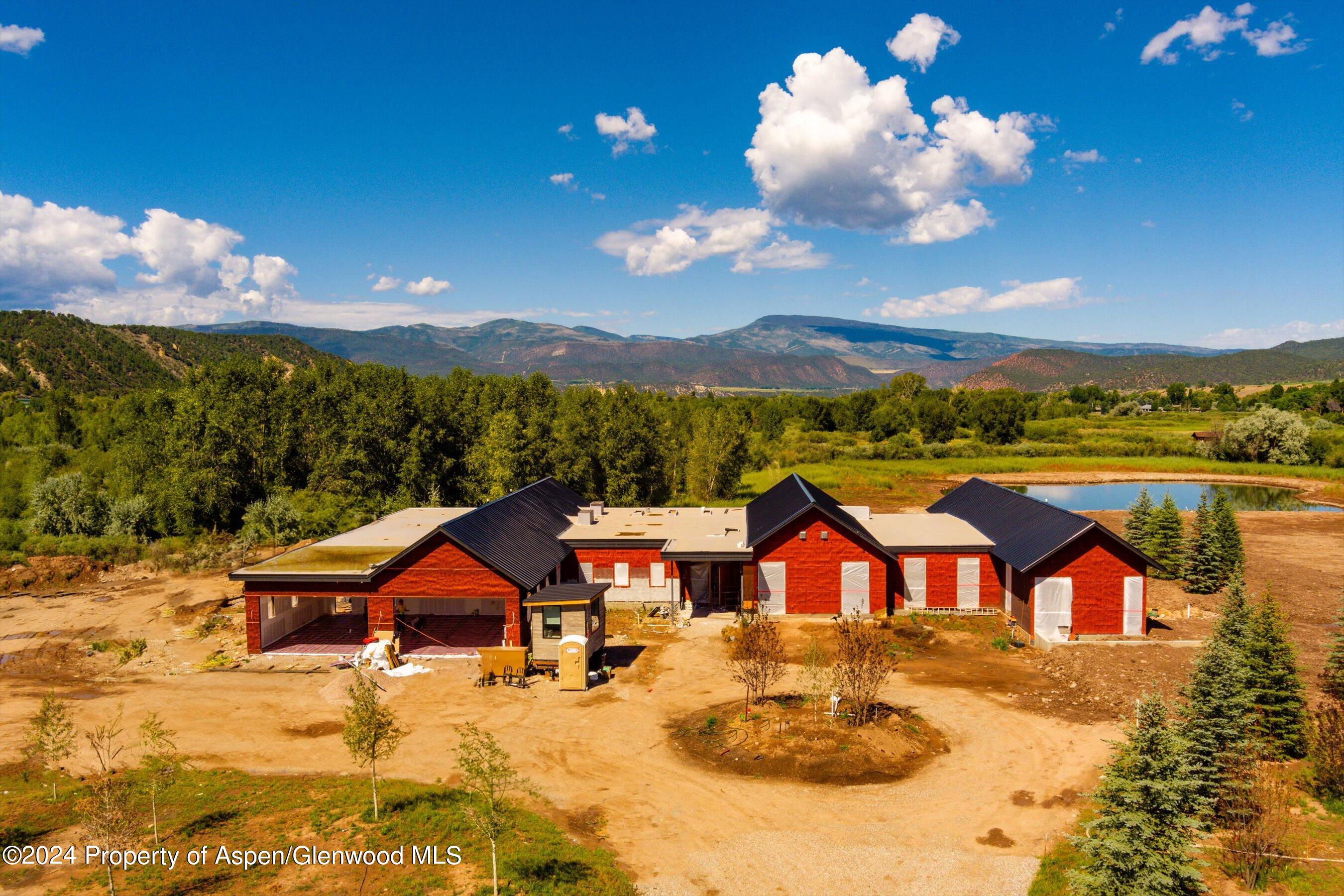 34 St Finnbar Farm Road Carbondale, CO 81623 - Photo 4 of 22 a view of a patio with a table and chairs under an umbrella