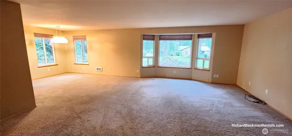 an entryway of a house with wooden floor and door
