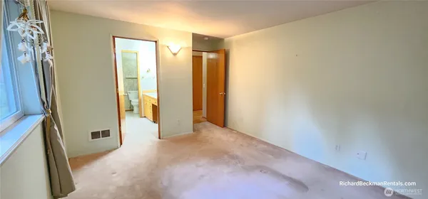 a bathroom with a sink a mirror and a shower