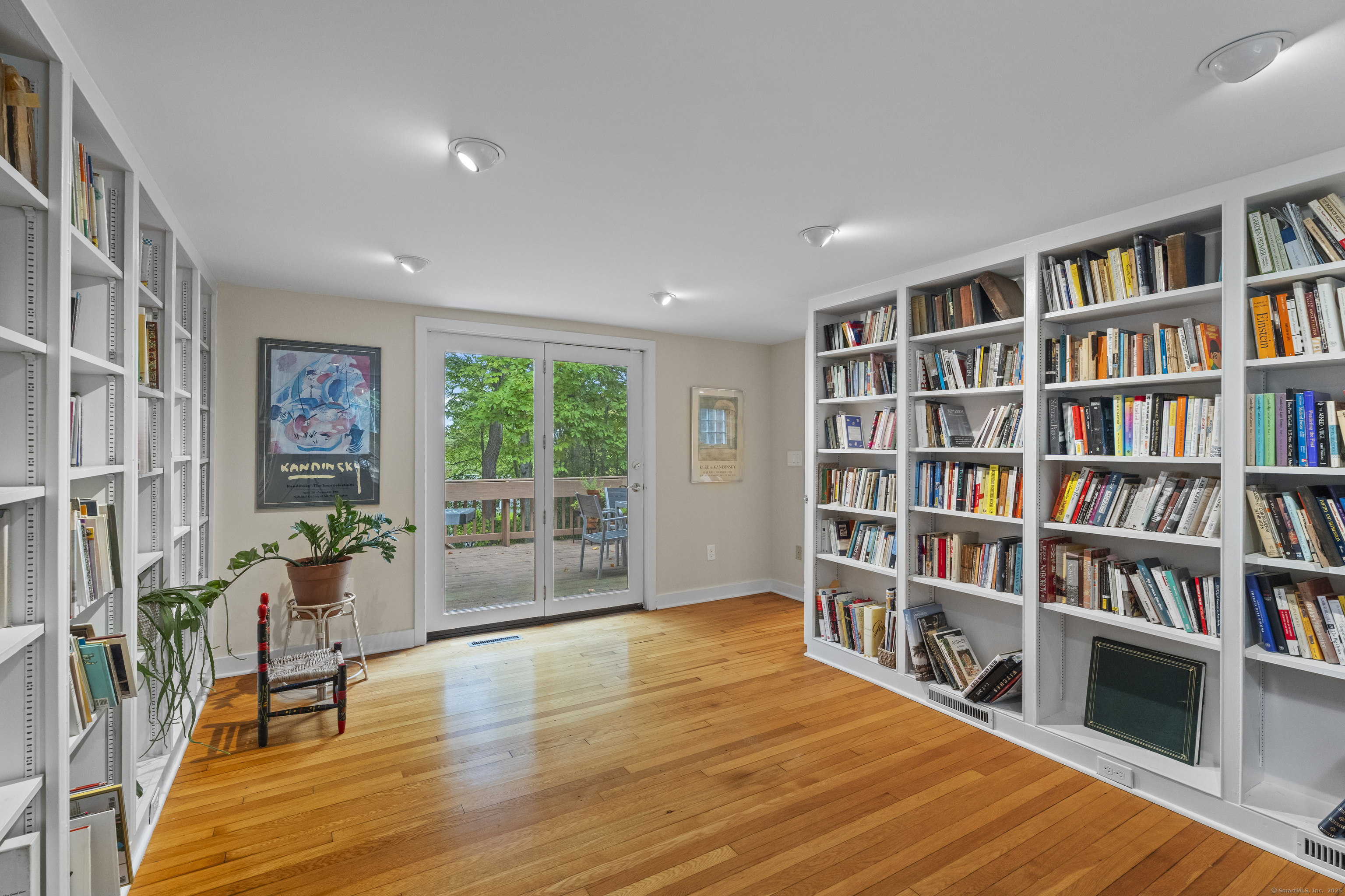 133 Blake Road Hamden, CT 06517 - Photo 16 of 40 a living room with bookshelf and a book shelf