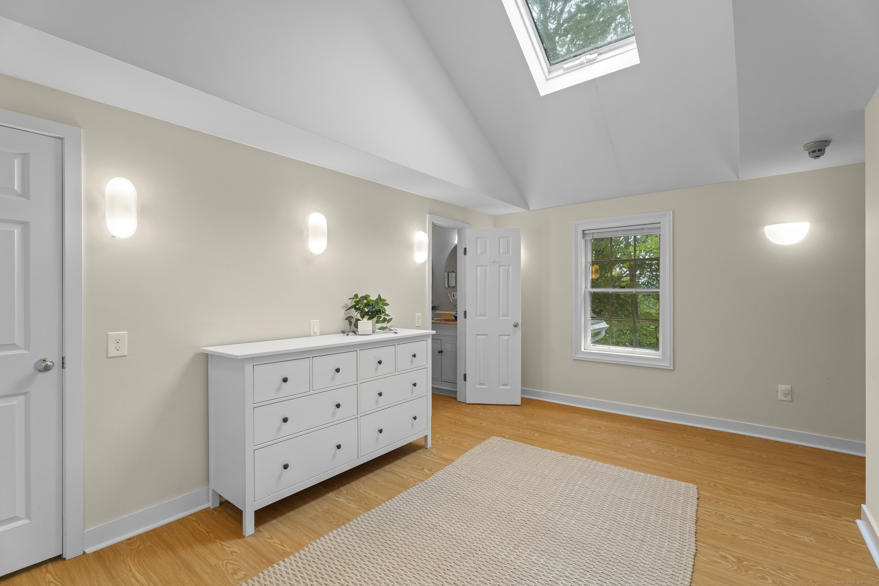 133 Blake Road Hamden, CT 06517 - Photo 22 of 40 a view of room with window and wooden floor