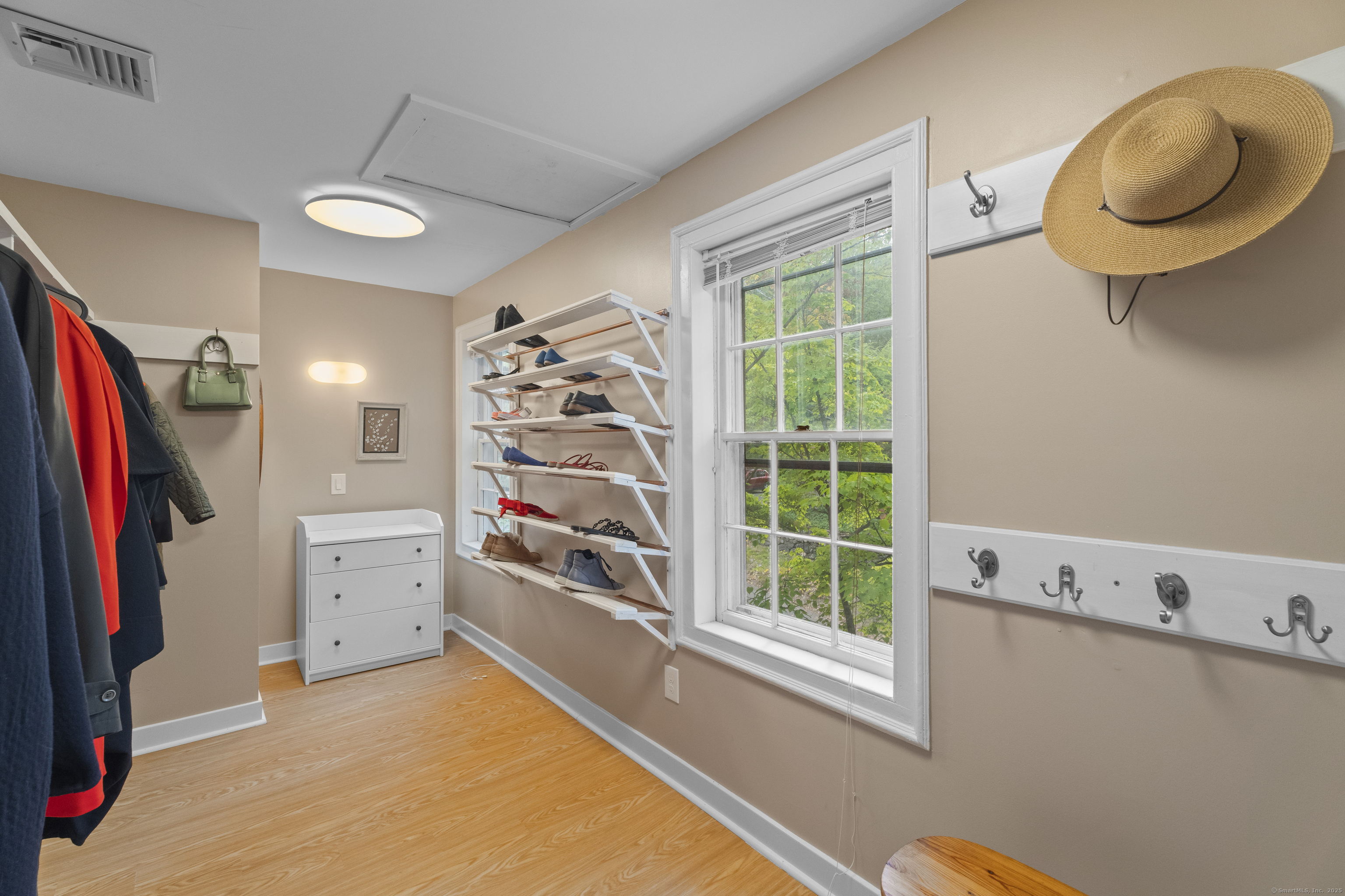 133 Blake Road Hamden, CT 06517 - Photo 24 of 40 a view of walk in closet with clothes and shoes