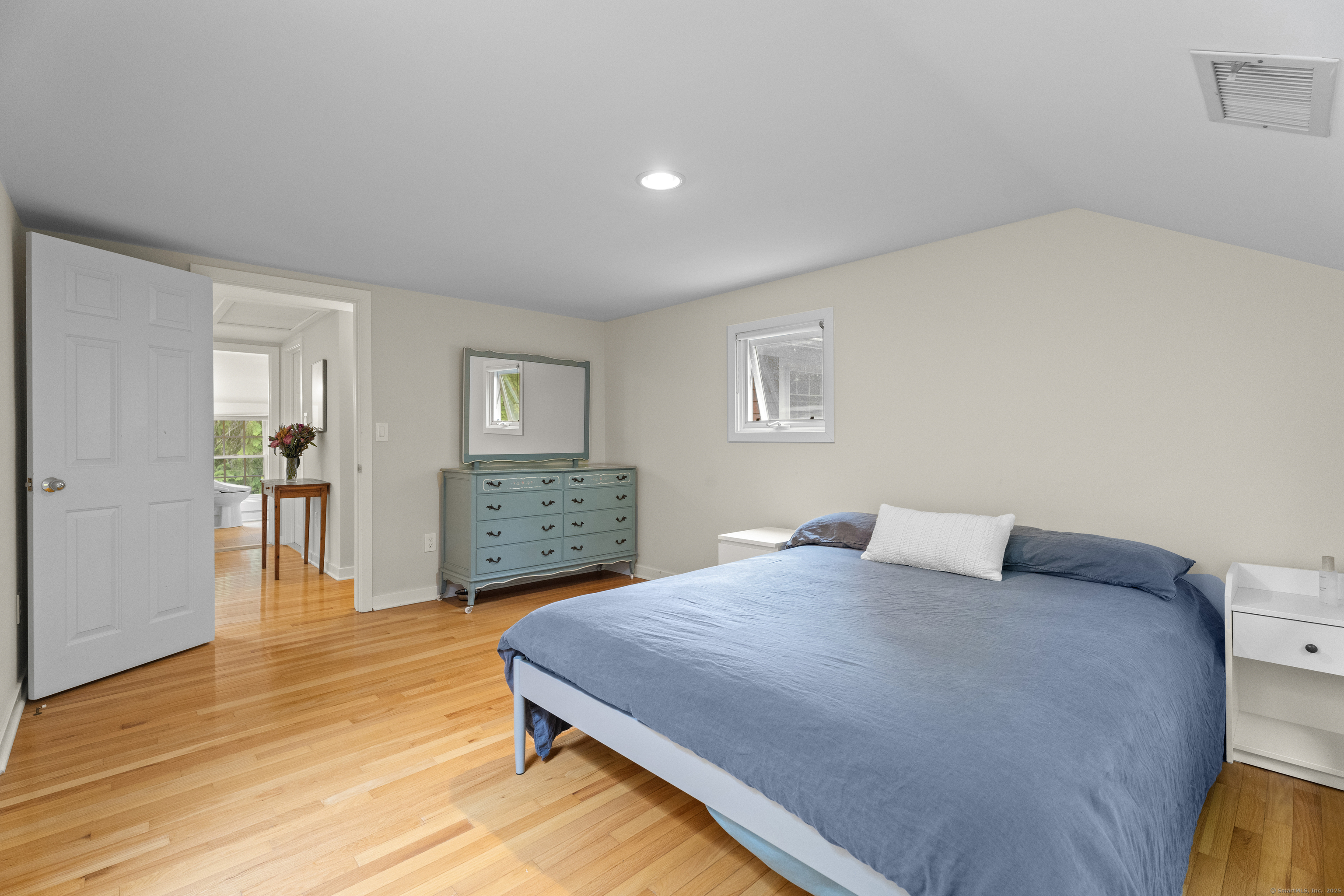 133 Blake Road Hamden, CT 06517 - Photo 25 of 40 a bedroom with a bed and wooden floor