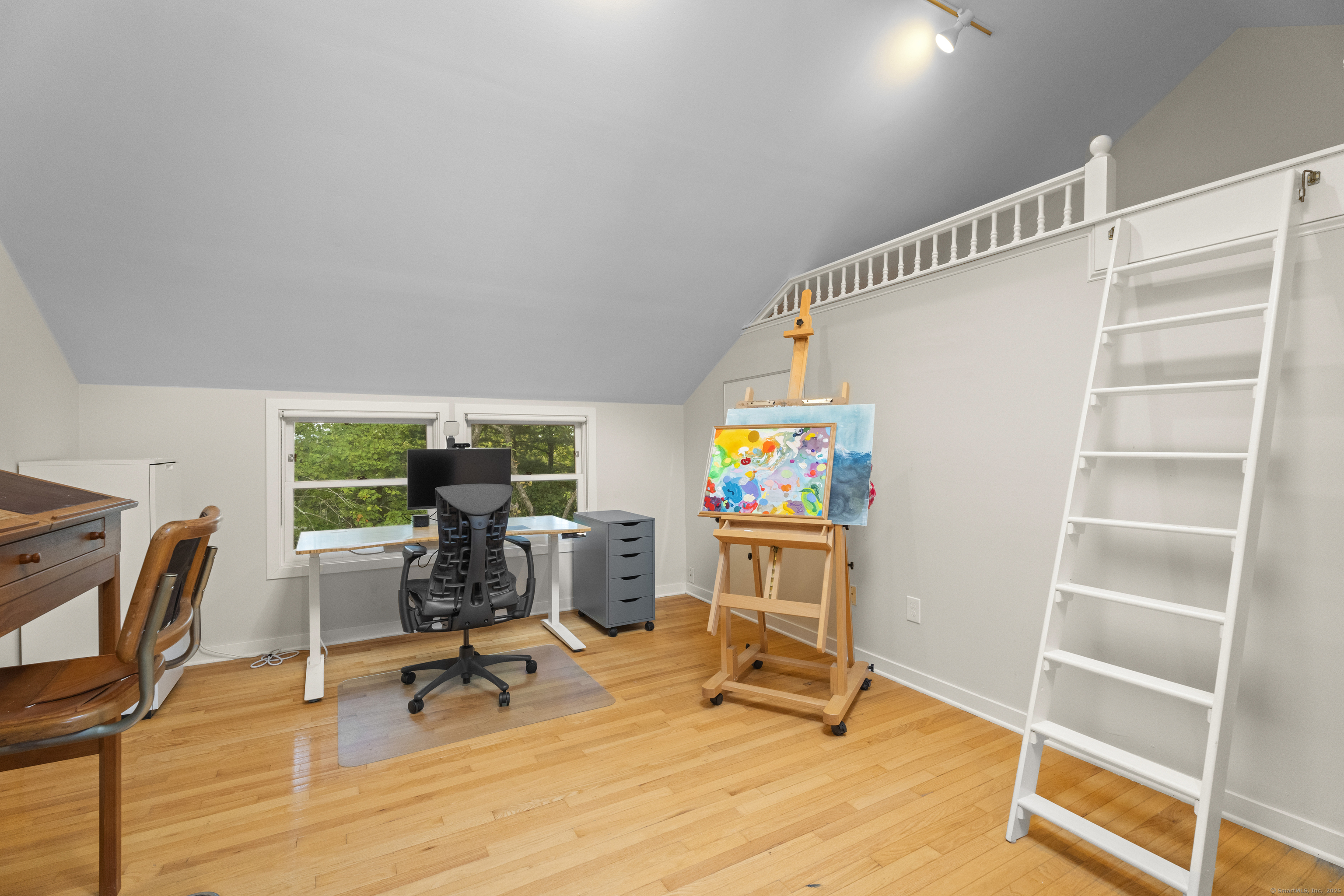 133 Blake Road Hamden, CT 06517 - Photo 29 of 40 a view of a workspace with furniture and a window