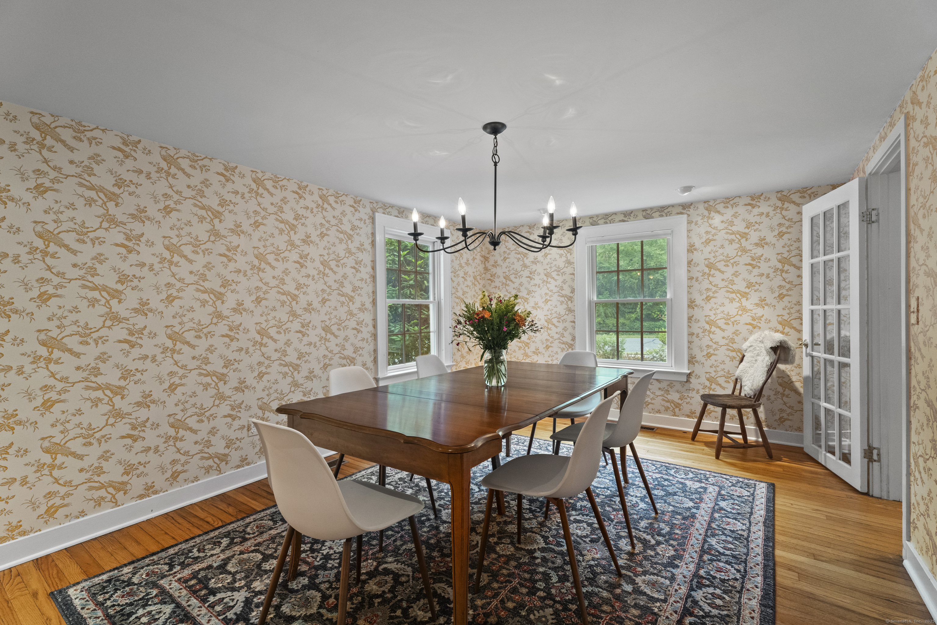 133 Blake Road Hamden, CT 06517 - Photo 7 of 40 a view of a dining room with furniture window and wooden floor