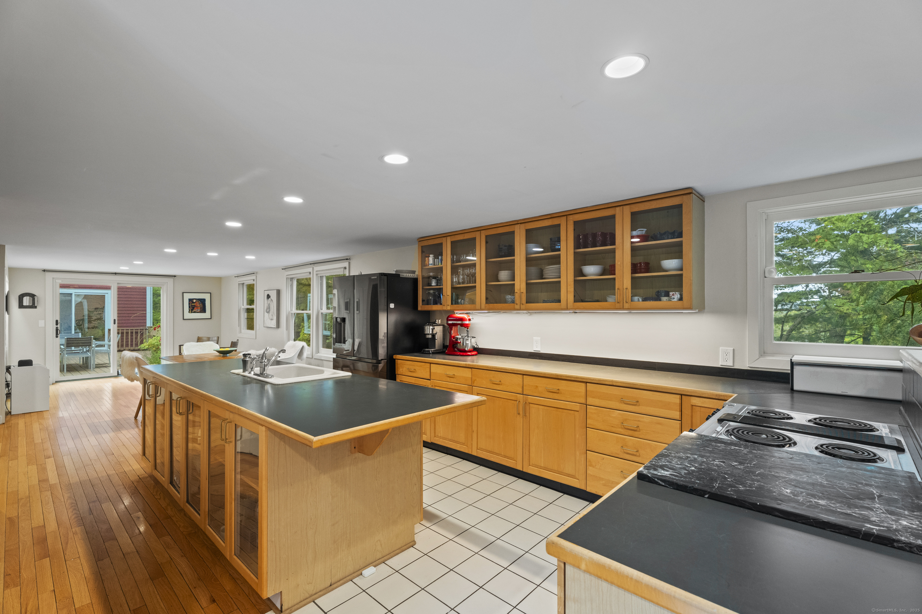 133 Blake Road Hamden, CT 06517 - Photo 8 of 40 a kitchen with stainless steel appliances granite countertop a sink and a stove