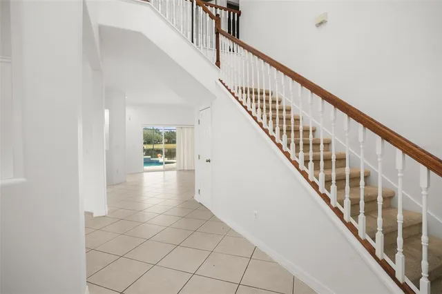 a view of an entryway with wooden floor