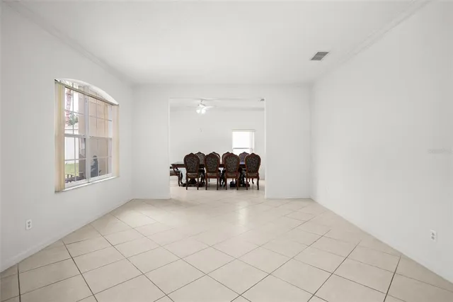 a view of workspace with furniture and window