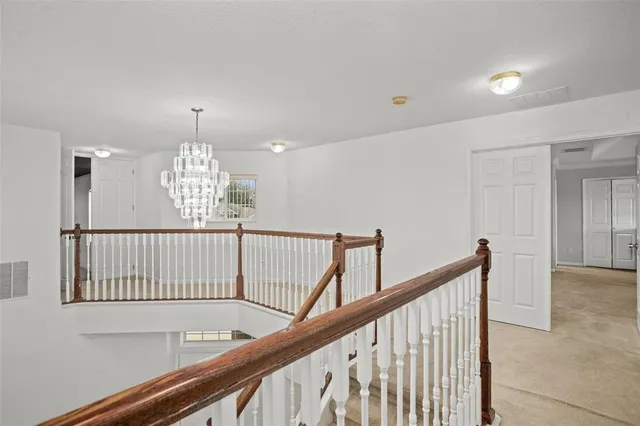 a view of a hallway view with staircase