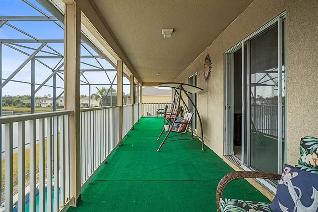 a balcony with furniture and a garden