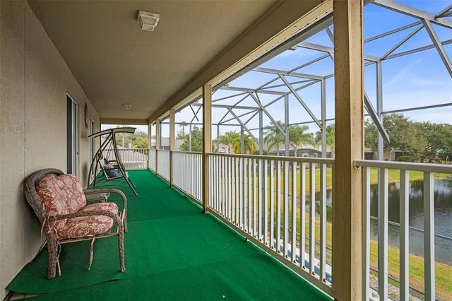 a view of a livingroom with a ceiling fan and window