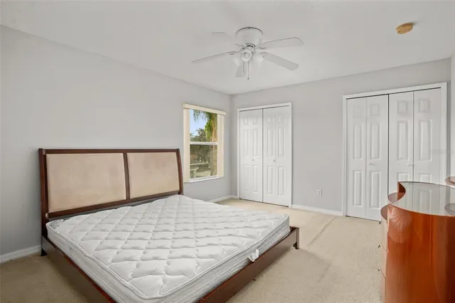 a bedroom with a bed and a mirror