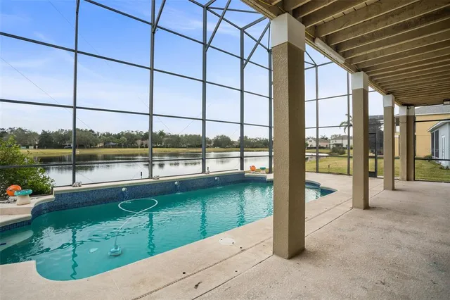 a view of a living room and floor to ceiling window